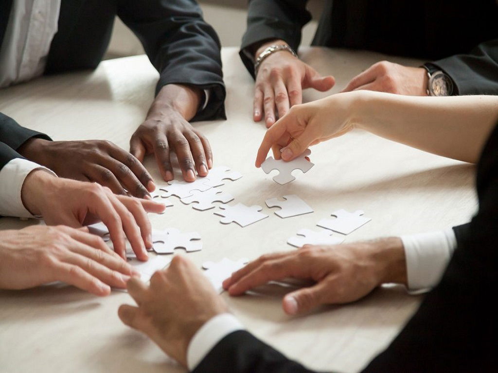 Working professionals playing puzzle games.