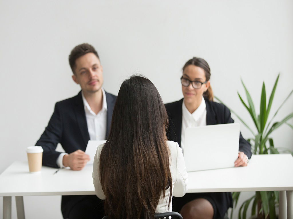 Recruiters interviewing a girl.